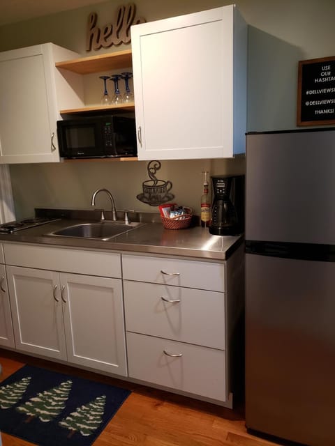 Fridge, microwave, stovetop, coffee/tea maker