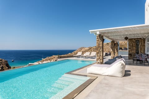 An infinity pool, sun loungers