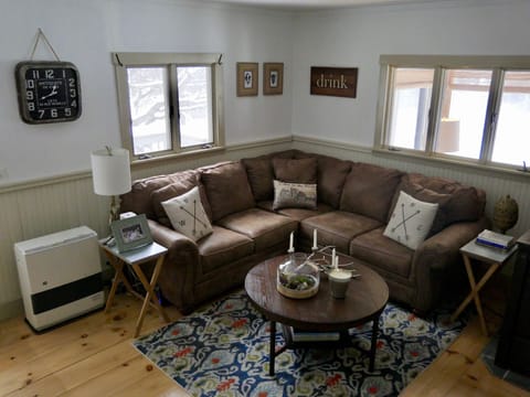 The living room is perfect for curling up w/ a book or gathering for games. 