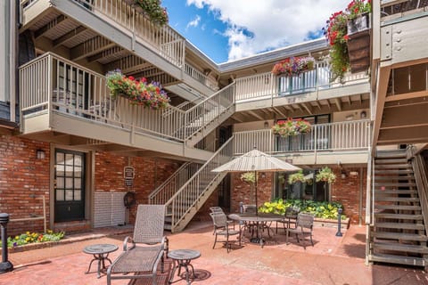 The courtyard at Chateau Dumont is a great spot to relax on a warm Aspen afternoon.