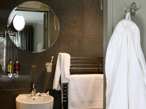 Bathroom | Hair dryer, towels, soap, toilet paper