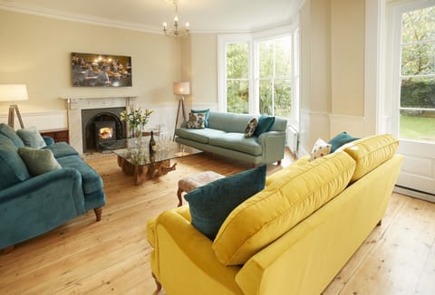 Ground floor: Spacious open-plan sitting room with wood burning stove