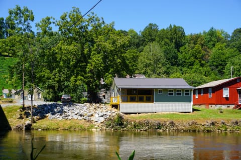 Exterior View - View of back of home and river in back yard.