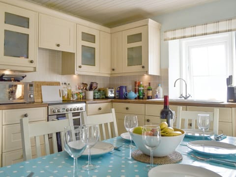 Well-equipped kitchen with dining space | Shore Cottage, Arnisdale, near Glenelg