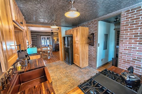 Another view of the kitchen with retro appliances, refrigerator and dining area.