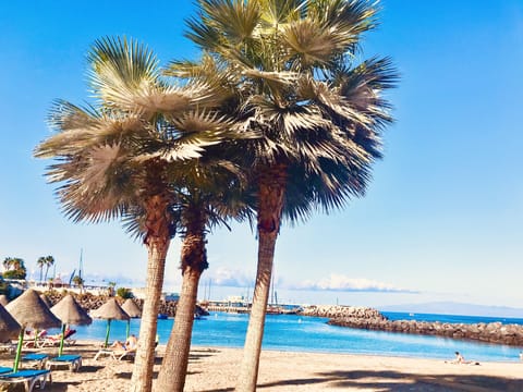 On the beach, sun loungers, beach towels