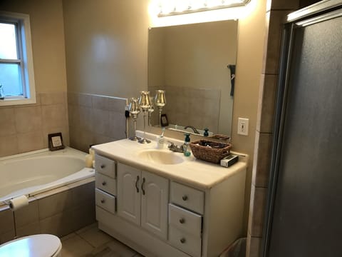 Combined shower/tub, hair dryer, towels, soap