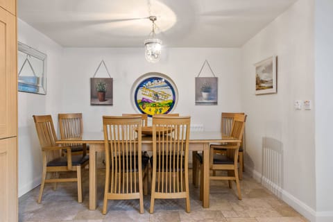 Kitchen has a dining area to one end which comfortably seats 8. 