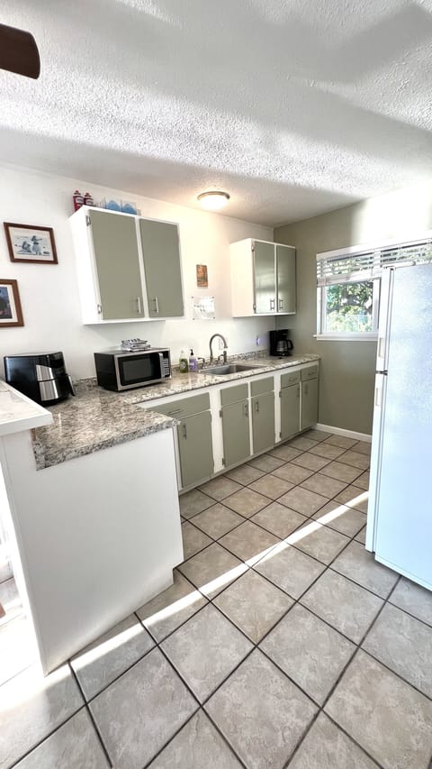 Full kitchen with oven and full size fridge
