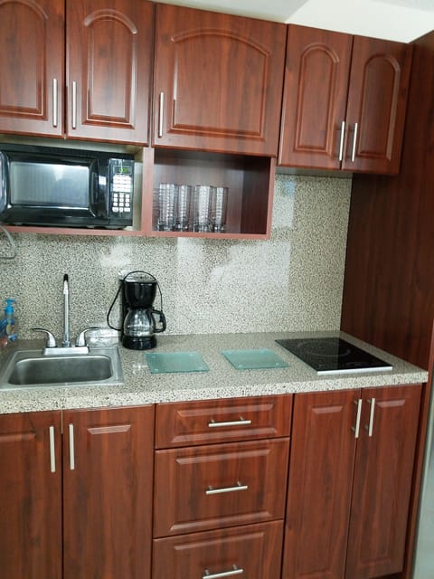 Fridge, microwave, stovetop, coffee/tea maker