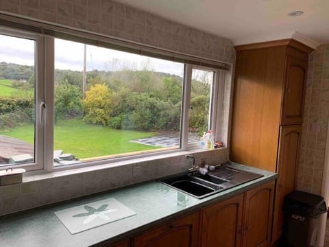 Kitchen area showing views over rear garden & valley. 