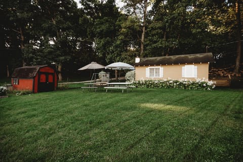 View of Cottage from the Lake (Cottage has recently been painted Maroon)