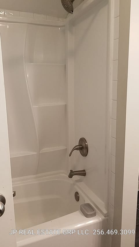 Combined shower/tub, hair dryer, towels, soap