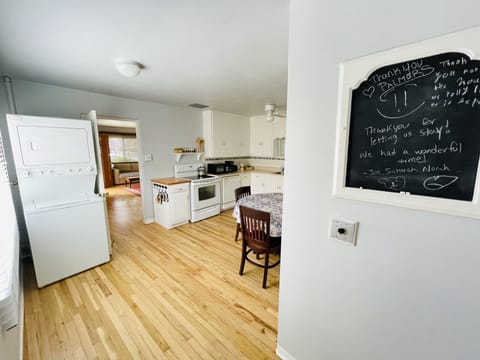 Fully stocked kitchen with washer and dryer