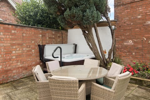 Back garden with hot tub.  Two to four person hot tub