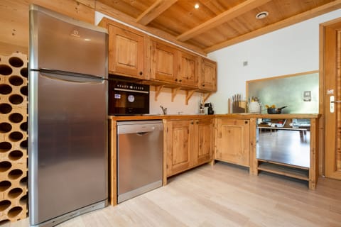 Kitchen with dishwasher and large fridge