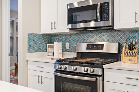 Fully stocked gourmet kitchen featuring top of the line appliances