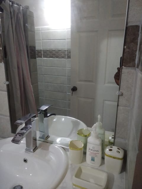 Shower, hair dryer, towels, shampoo