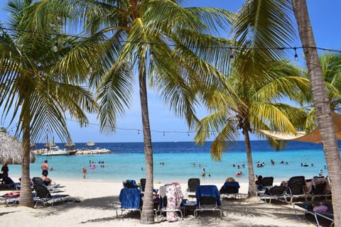 On the beach, sun loungers, beach towels