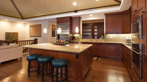 Large kitchen equipped with spices and oils