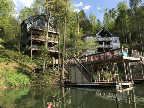 View of house and dock from cove. 