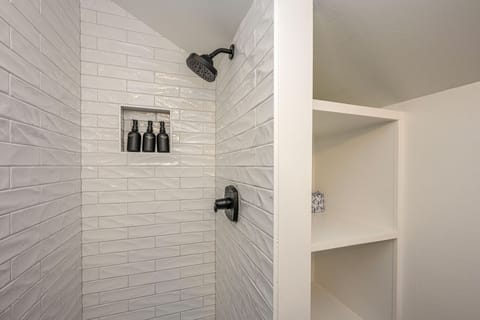 Combined shower/tub, hair dryer, towels, soap