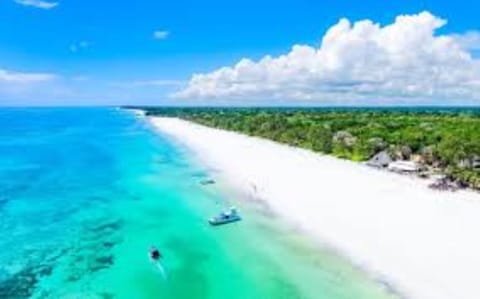 On the beach, sun loungers, beach towels