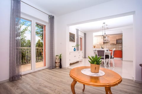 Living and dining area are connected with fully equipped kitchen.