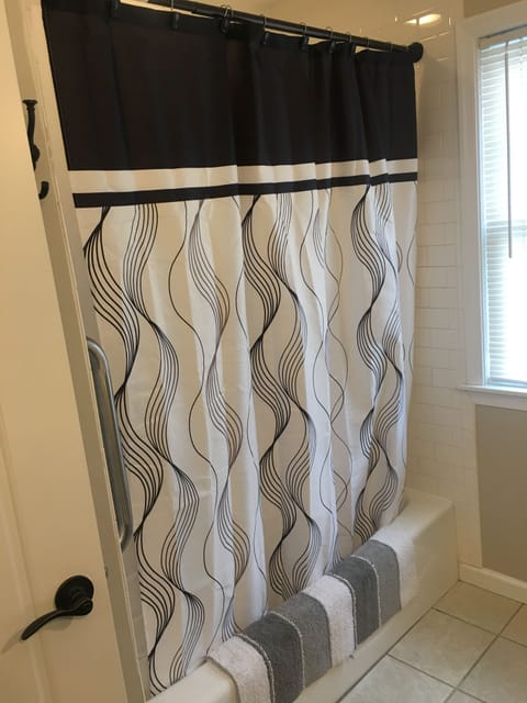 Combined shower/tub, hair dryer, towels, soap