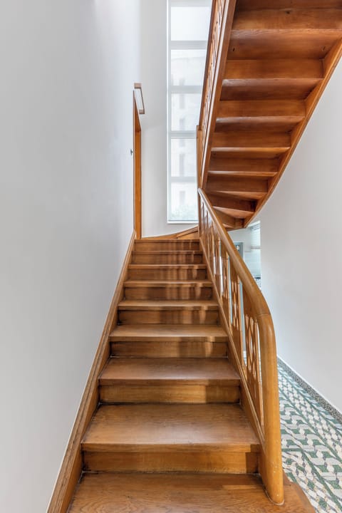 The beautiful, original staircase leads you to the upper floors, where three of our bedrooms and master bathroom are located