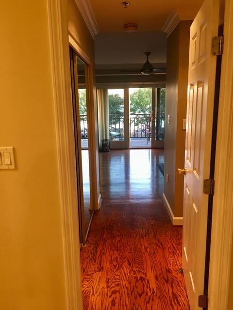 Looking down the hallway from the second bedroom toward the master bedroom
