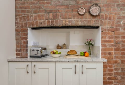 Ground floor: Exposed brickwork in this magnificent farmhouse kitchen