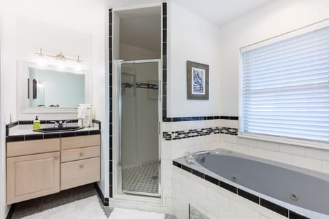 Shower, jetted tub, hair dryer, towels