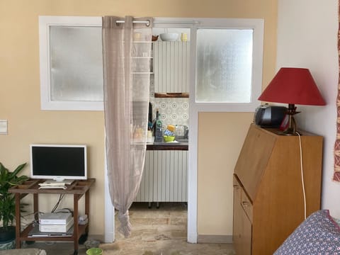 Day view looking into separated kitchen area.