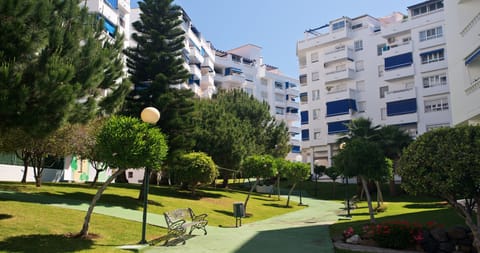 Gardens between the swimming pool and the apartment building.