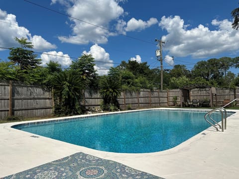 Enjoy the pool behind the 8ft tall privacy fence. 
