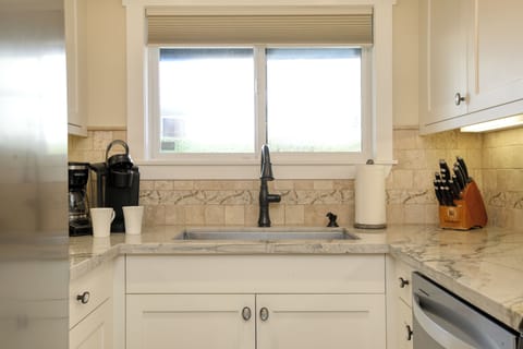 This kitchen is the perfect space to gather, cook, and enjoy the laid-back beach lifestyle.