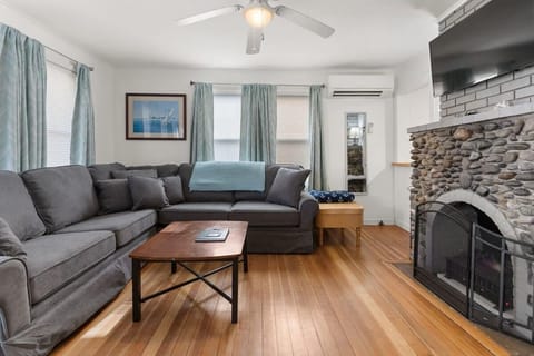 Cozy and comfortable living space with a brand new (spring 2022) wrap around sectional couch, 40” Samsung Smart TV and a central air temperature controlled mini-split system.