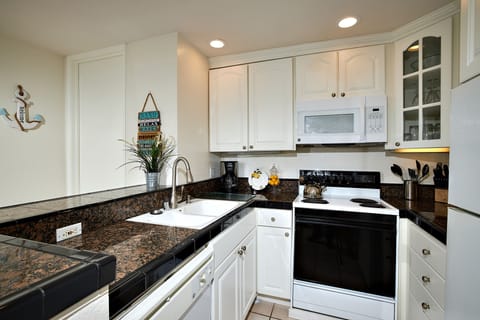 The remodeled kitchen is fully equipped with dishes, pots & pans, cooking utensils and serving pieces.