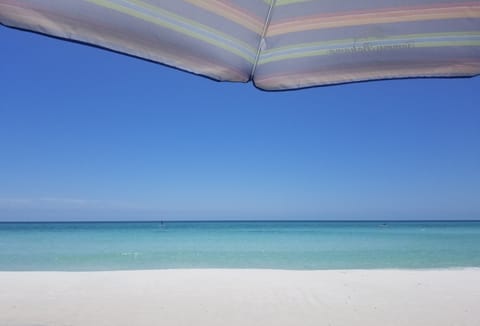 On the beach, sun loungers, beach towels