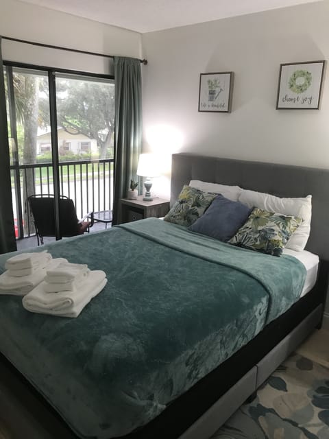 Guest room with queen bed; opens out to the screened patio