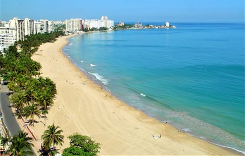 On the beach, sun loungers, beach towels