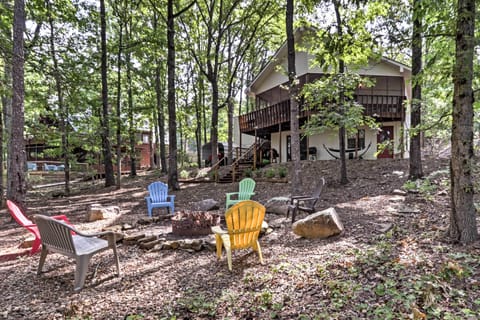 Set in Fairfield Bay, the home boasts a fire pit, covered deck and hammock.