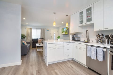 The kitchen is well stocked with cookware, utensils, silverware, and glassware. Permit #str14-0085