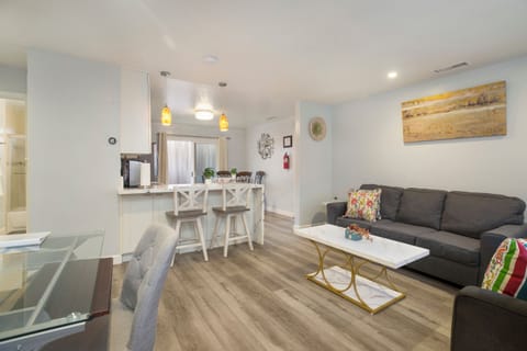 Relax in the comfort of this living room after a day at the Beach. Permit #str14-0085