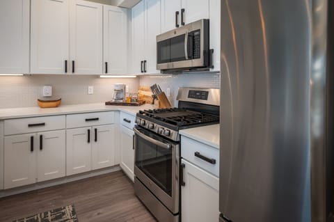 Stainless steel appliances and plenty of storage for food and beverages.