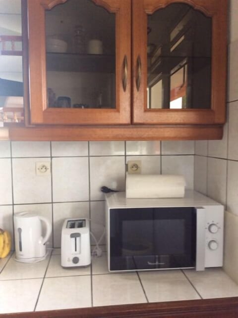 Microwave, coffee/tea maker, cookware/dishes/utensils