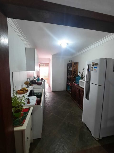 Fridge, stovetop, cookware/dishes/utensils, dining tables