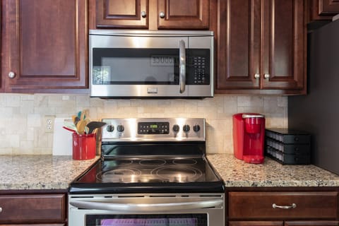 Fully stocked kitchen with pots, pans, and everything you need to cook a meal.