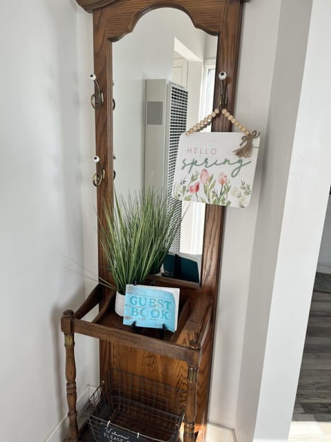 Hall tree to hang hats, keys, and courtesy shoe storage below.